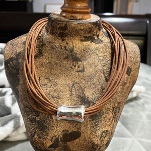 Silpada necklace with multi strand tan leather cord.